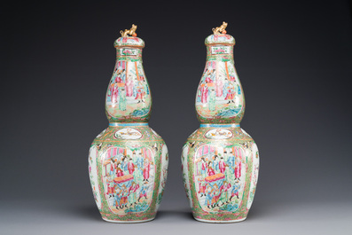 A pair of Chinese Canton famille rose double gourd vases and covers, 19th C.