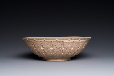 A large Chinese Yixing stoneware bowl with relief design, Qianlong mark, 18/19th C.