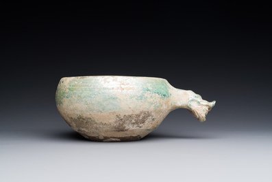 A Chinese monochrome green-glazed pottery scoop, Han