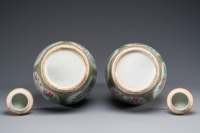 A pair of Chinese Canton famille rose double gourd vases and covers, 19th C.