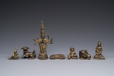 A collection of Chinese and Sino-tibetan bronze sculptures and paper weights, Qing