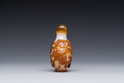 A rare Chinese brown-overlay white glass snuff bottle with chilong design, Qianlong/Jiaqing