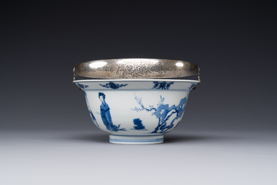 A Chinese blue and white bowl depicting playing boys and ladies with a mounted silver handle, Chenghua mark, Kangxi