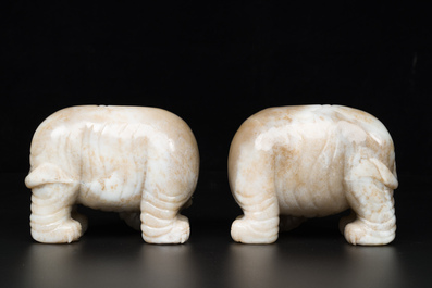 A pair of Chinese white and russet jade sculptures of elephants, Qianlong