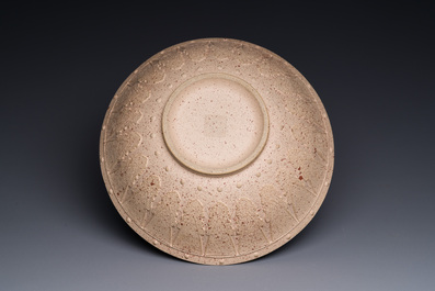 A large Chinese Yixing stoneware bowl with relief design, Qianlong mark, 18/19th C.