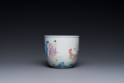 A Chinese famille rose cup with a boy and a rooster on wooden base, Qianlong mark, 20th C.
