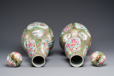 A pair of Chinese Canton famille rose double gourd vases and covers, 19th C.