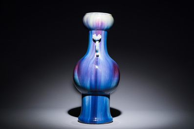 A Chinese flamb&eacute;-glazed garlic-mouth vase with ruyi handles, 19th C.