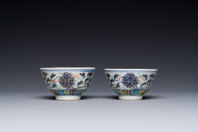 A pair of Chinese doucai 'lotus scroll' cups, Guangxu mark and of the period