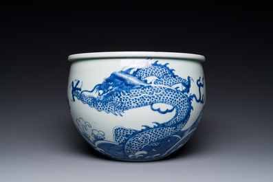 A Chinese blue and white 'dragon and carp' jardini&egrave;re, 19th C.