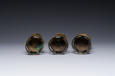 Two Chinese bronze censers, one with stand and three vases, Xuande mark, 19/20th C.