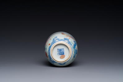 A Chinese famille rose cup with a boy and a rooster on wooden base, Qianlong mark, 20th C.