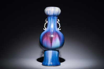 A Chinese flamb&eacute;-glazed garlic-mouth vase with ruyi handles, 19th C.