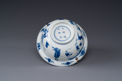 A Chinese blue and white bowl depicting playing boys and ladies with a silver handle, Chenghua mark, Kangxi
