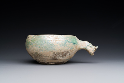 A Chinese monochrome green-glazed pottery scoop, Han