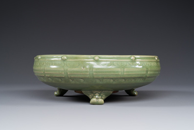 A Chinese Longquan celadon tripod censer on wooden stand, Yuan/Ming