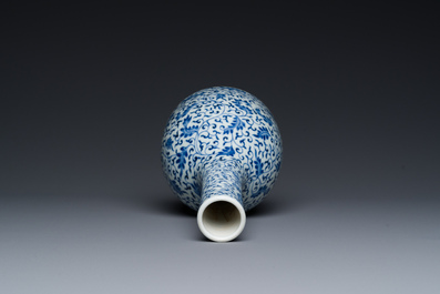 A Chinese blue and white 'lotus scroll' bottle vase, Yongzheng mark and possibly of the period