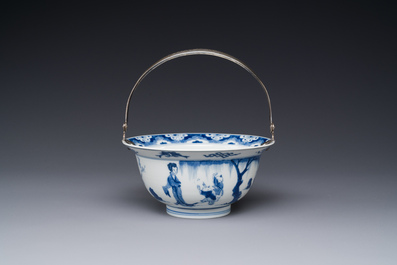 A Chinese blue and white bowl depicting playing boys and ladies with a mounted silver handle, Chenghua mark, Kangxi