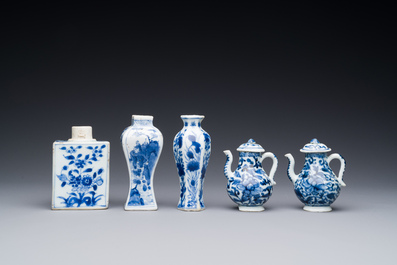 Two Chinese blue and white vases, two miniature jugs and a tea caddy, Kangxi
