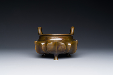 A Chinese bronze lotus-shaped tripod censer, Xuande mark, 18/19th C.