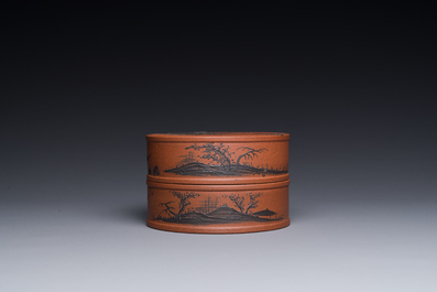 A Chinese blue-enameled Yixing stoneware box and cover with a mountainous landscape, 18/19th C.