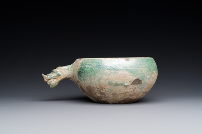 A Chinese monochrome green-glazed pottery scoop, Han