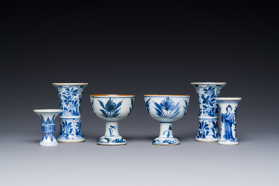 Two Chinese blue and white stem cups and four miniature 'gu' vases, Kangxi
