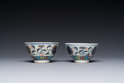 A pair of Chinese doucai 'lotus scroll' cups, Guangxu mark and of the period