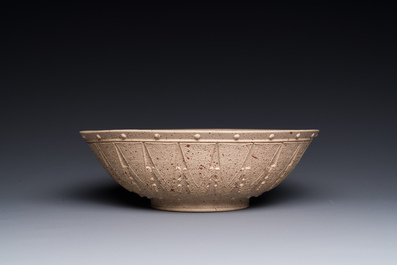 A large Chinese Yixing stoneware bowl with relief design, Qianlong mark, 18/19th C.