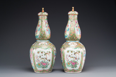 A pair of Chinese Canton famille rose double gourd vases and covers, 19th C.