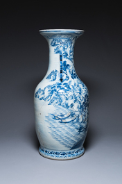 A large Chinese blue, white and copper-red vase with a mountainous river landscape, 19th C.