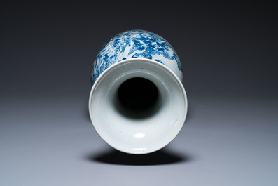 A large Chinese blue, white and copper-red vase with a mountainous river landscape, 19th C.