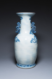 A large Chinese blue, white and copper-red vase with a mountainous river landscape, 19th C.