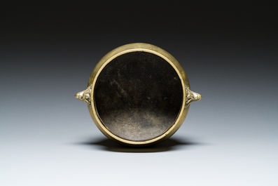 A Chinese bronze elephant-head-handled censer, Xuande mark, Kangxi/Qianlong
