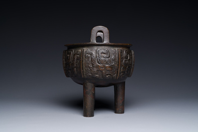 A Chinese archaistic bronze tripod censer on wooden stand, 'ding', Song/Ming