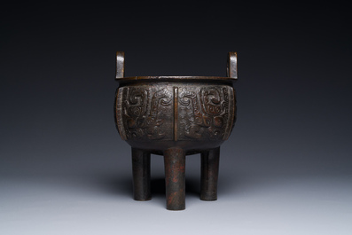 A Chinese archaistic bronze tripod censer on wooden stand, 'ding', Song/Ming