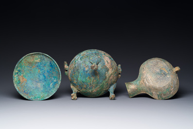 A group of four Chinese archaic bronze wares, late Shang, Warring States and Han