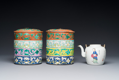 A pair of Chinese famille rose four-tier stacking boxes and a teapot, 19th C.