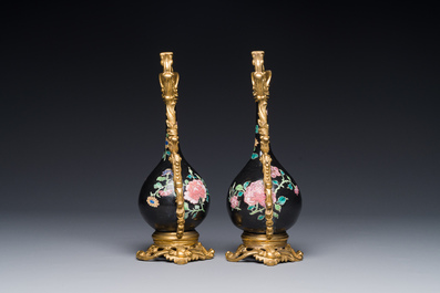 A pair of Chinese black-ground famille rose vases with gilt bronze mounts, Yongzheng