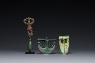 A collection of three bronze axes, a mirror and an anthropomorphic idol with two dragon heads, Luristan, 2000 B.C and earlier
