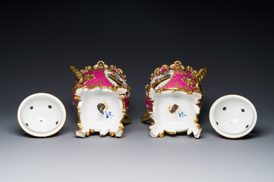 A pair of French parcel-gilt polychrome pink-ground porcelain potpourri vases, Jacob Petit, Paris, 19th C.