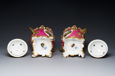 A pair of French parcel-gilt polychrome pink-ground porcelain potpourri vases, Jacob Petit, Paris, 19th C.