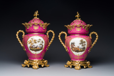 A pair of French parcel-gilt polychrome pink-ground porcelain potpourri vases, Jacob Petit, Paris, 19th C.