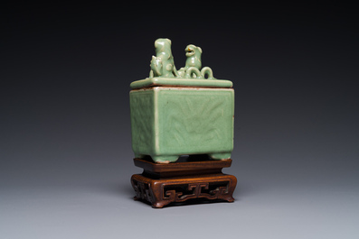 A Chinese Longquan celadon rectangular censer and cover on wooden stand, Ming