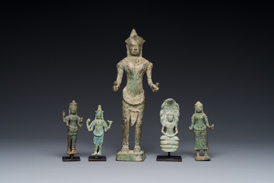 A group of five bronze figures of Shiva, Bodhisattva and Uma, Cambodia, 11/16th C.