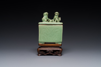 A Chinese Longquan celadon rectangular censer and cover on wooden stand, Ming