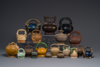A large collection of nineteen Vietnamese stoneware lime pots, 14th C. and later