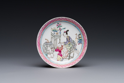 A Chinese famille rose cup and saucer with a court lady and a boy, Yongzheng