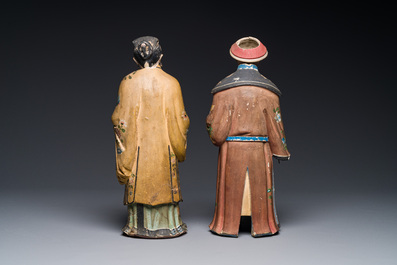 A pair of Chinese export polychrome decorated clay nodding head figures, 18/19th C.