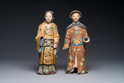 A pair of Chinese export polychrome decorated clay nodding head figures, 18/19th C.